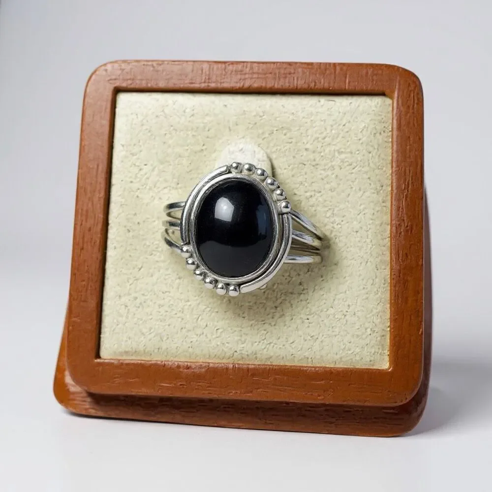 Bold Elegance: Handcrafted Sterling Silver Ring with Oval Black Star Diopside